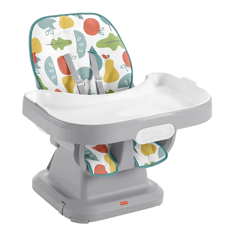 Fisher-Price SpaceSaver Simple Clean high chair in Pearfection print strapped to a dining chair position